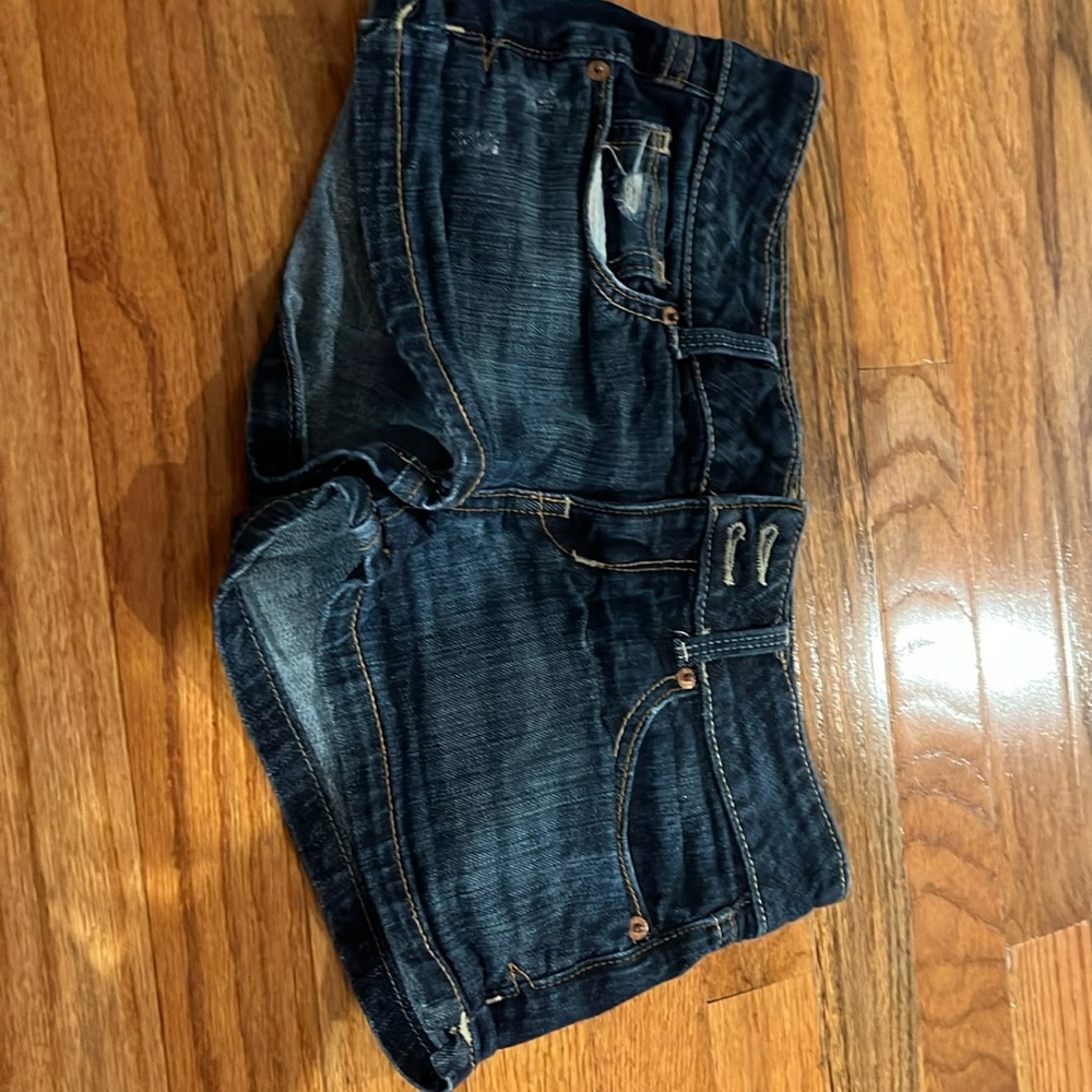 Blue Jean shorts with two pockets front and back with two buttons and zipper